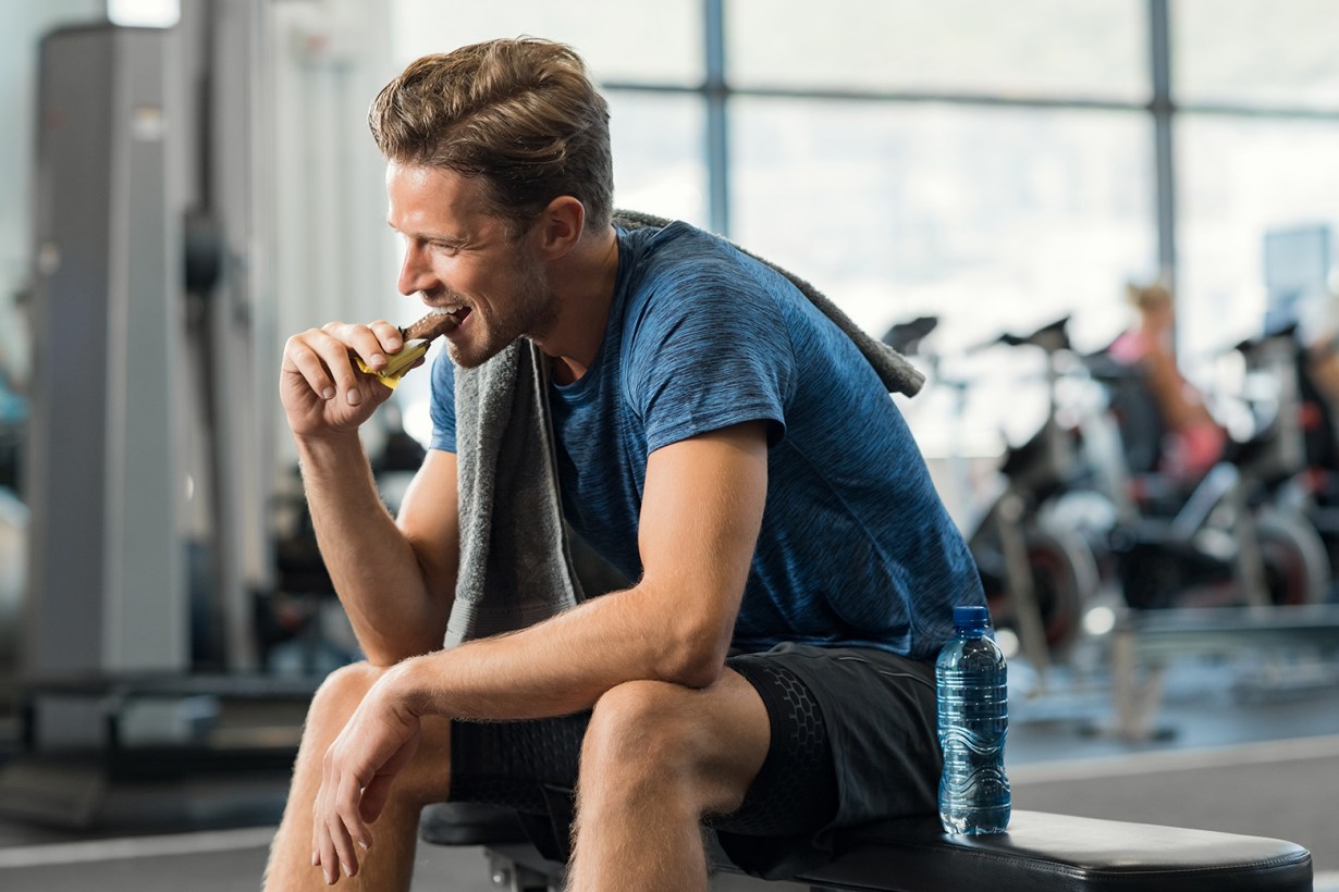 a man eating an energy bar