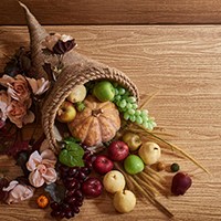 a cornucopia basket filled with food